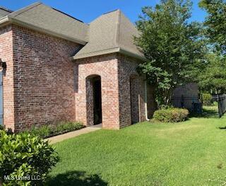 3808 Acadian Village Dr, Ocean Springs, MS 39564 - property entrance with brick siding