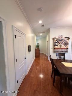 3808 Acadian Village Dr, Ocean Springs, MS 39564 - hall with crown molding, wood finished floors, and baseboards