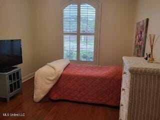3808 Acadian Village Dr, Ocean Springs, MS 39564 - bedroom featuring wood finished floors and multiple windows