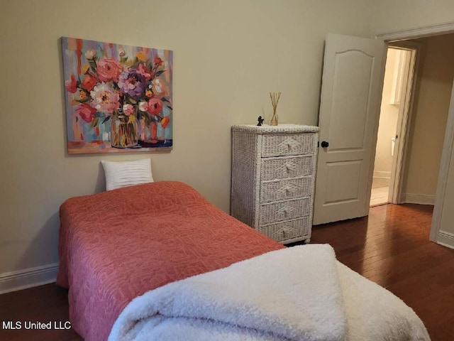 3808 Acadian Village Dr, Ocean Springs, MS 39564 - bedroom featuring wood finished floors and baseboards