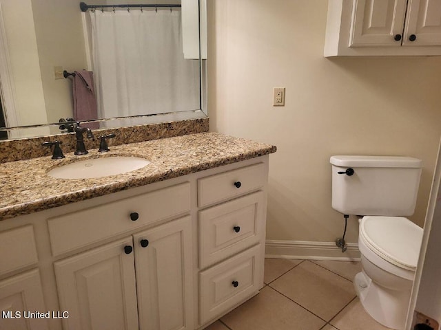 3808 Acadian Village Dr, Ocean Springs, MS 39564 - full bathroom with baseboards, toilet, tile patterned floors, vanity, and a shower with shower curtain