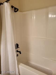 3808 Acadian Village Dr, Ocean Springs, MS 39564 - bathroom with shower / bathtub combination with curtain