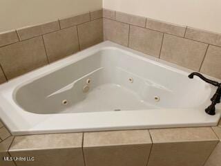 3808 Acadian Village Dr, Ocean Springs, MS 39564 - bathroom with a tub with jets