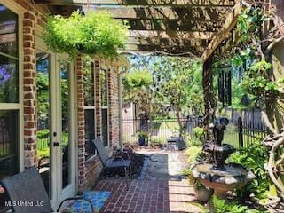 3808 Acadian Village Dr, Ocean Springs, MS 39564 - view of patio / terrace with fence and a pergola
