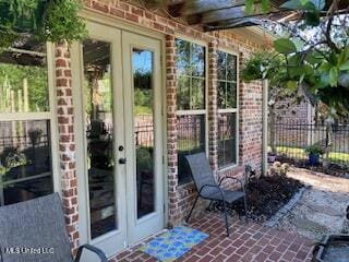 3808 Acadian Village Dr, Ocean Springs, MS 39564 - exterior space featuring french doors and fence