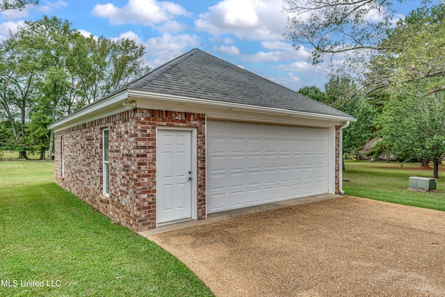 garage with a lawn