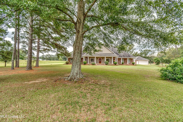 view of front of property with a front lawn and a garage