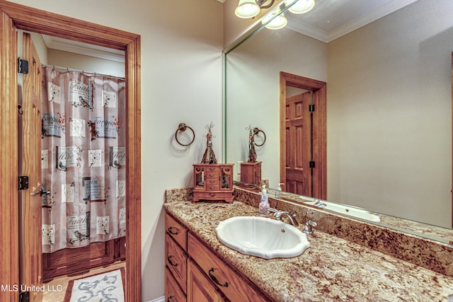 bathroom with vanity and crown molding