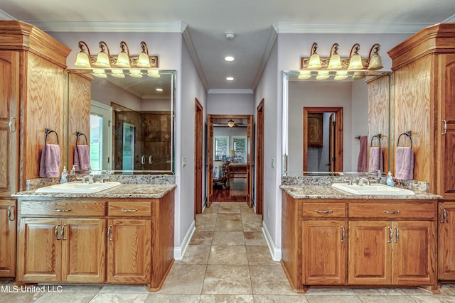 bathroom featuring vanity, tile patterned floors, and ornamental molding