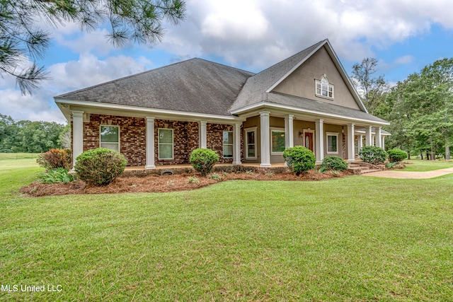 view of front facade with a porch and a front lawn