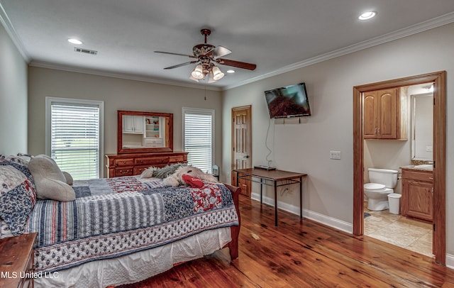 bedroom with ceiling fan, crown molding, light hardwood / wood-style flooring, and ensuite bathroom