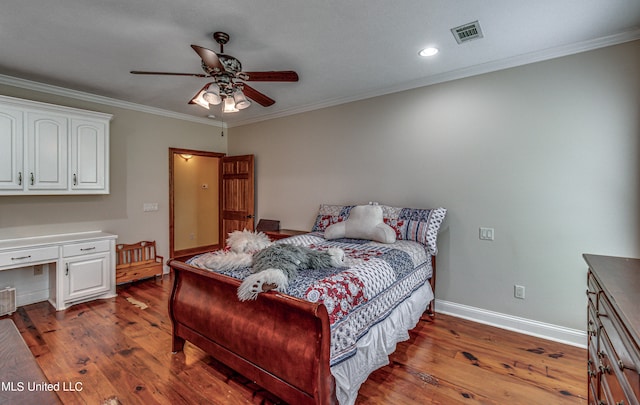 bedroom with ornamental molding, ceiling fan, and dark hardwood / wood-style flooring