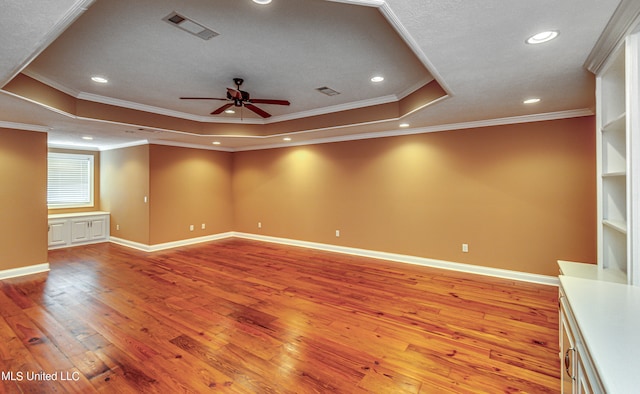 unfurnished room with light hardwood / wood-style floors, crown molding, and ceiling fan