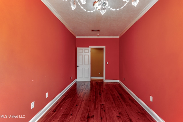 interior space featuring crown molding, a textured ceiling, an inviting chandelier, and hardwood / wood-style floors