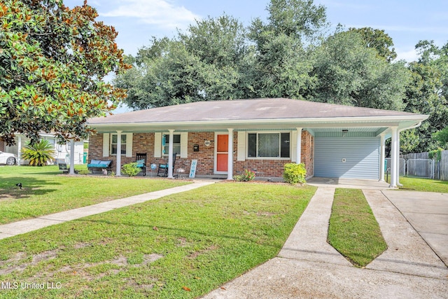 ranch-style house with covered porch, a front yard, and a carport