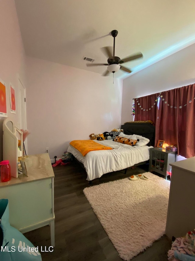 bedroom featuring dark wood-type flooring and ceiling fan