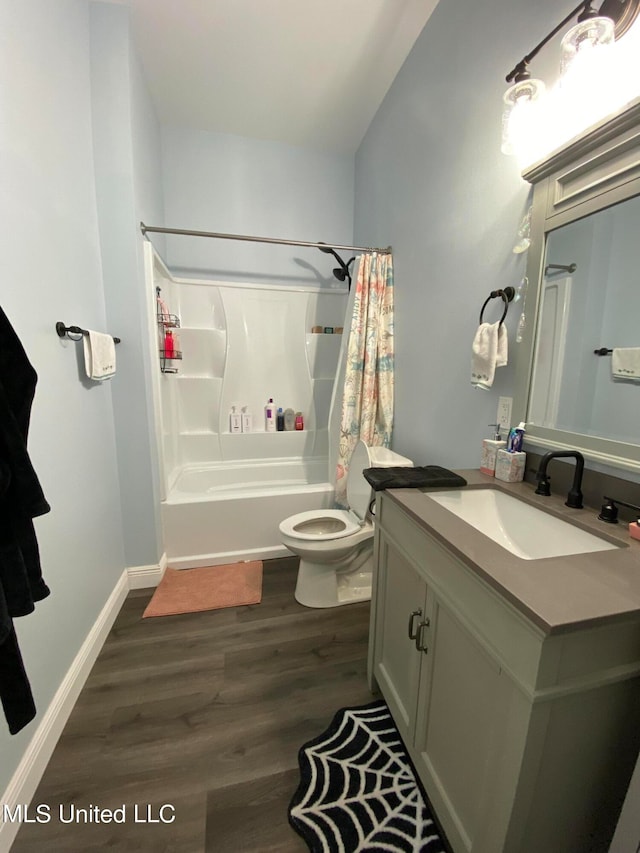 full bathroom featuring toilet, shower / bathtub combination with curtain, vanity, and wood-type flooring