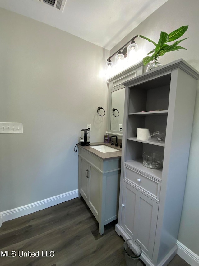 bathroom featuring vanity and hardwood / wood-style floors