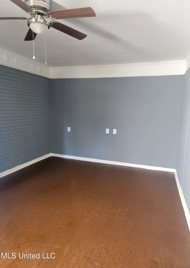 unfurnished room featuring crown molding, hardwood / wood-style flooring, brick wall, and ceiling fan