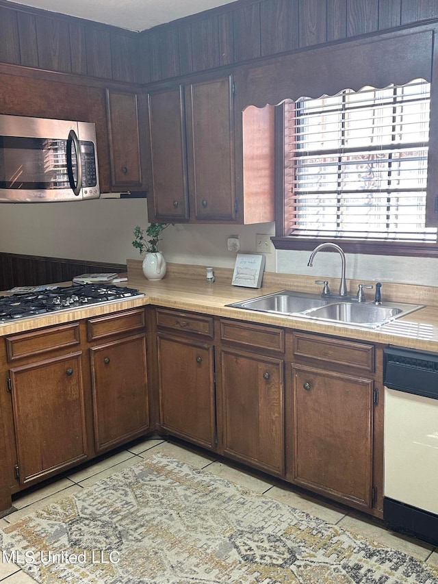 kitchen featuring dark brown cabinets, appliances with stainless steel finishes, and sink