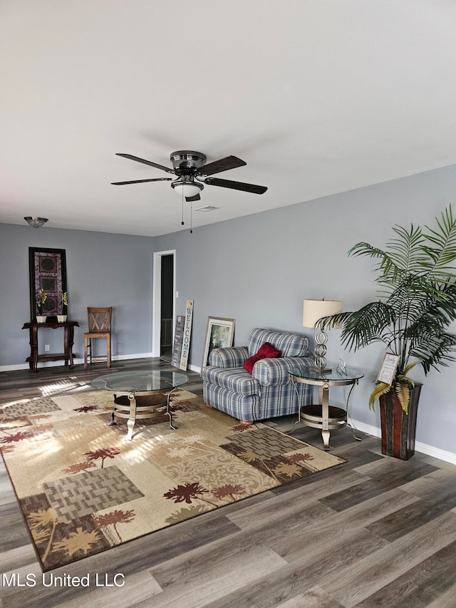 living room with hardwood / wood-style floors and ceiling fan