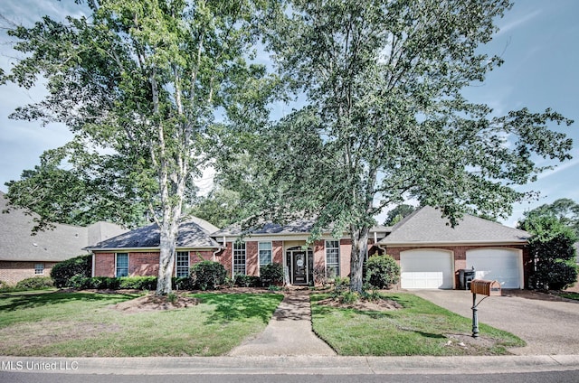 506 Ridge Cir, Brandon, MS 39047 - view of front of home featuring brick siding, a garage, a front yard, and driveway