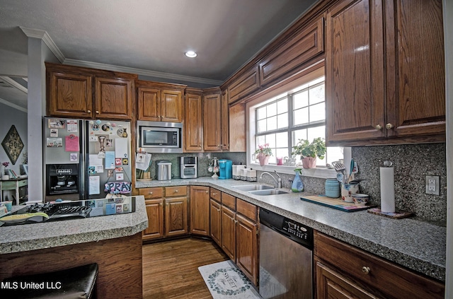 506 Ridge Cir, Brandon, MS 39047 - kitchen featuring stainless steel appliances, crown molding, dark wood finished floors, backsplash, and light countertops