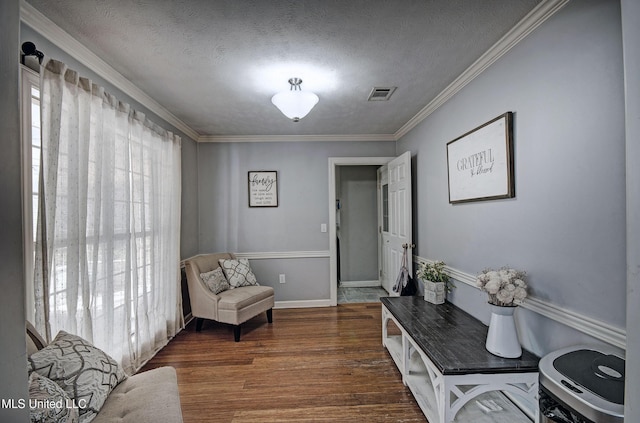 506 Ridge Cir, Brandon, MS 39047 - living area featuring wood finished floors, ornamental molding, and a textured ceiling