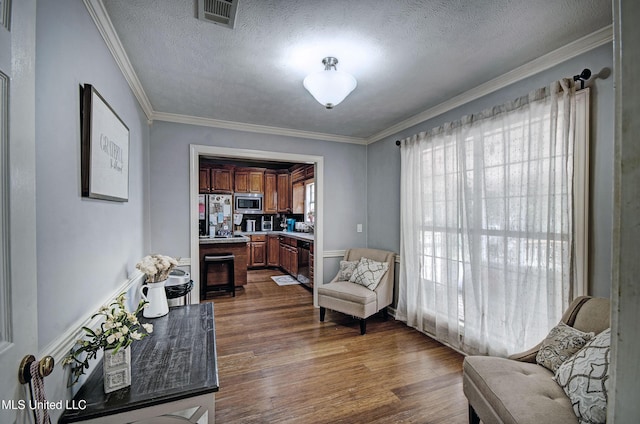 506 Ridge Cir, Brandon, MS 39047 - living area featuring dark wood-style floors, a textured ceiling, and crown molding