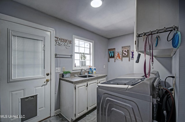 506 Ridge Cir, Brandon, MS 39047 - laundry area featuring cabinet space and washer and clothes dryer