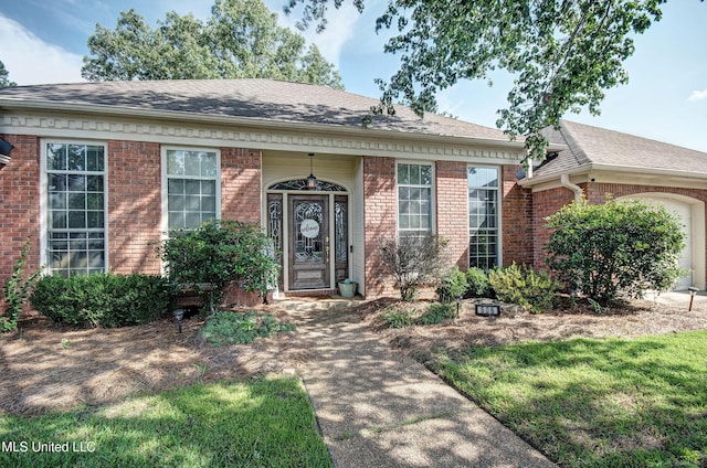 506 Ridge Cir, Brandon, MS 39047 - view of front of property with brick siding, a shingled roof, and an attached garage