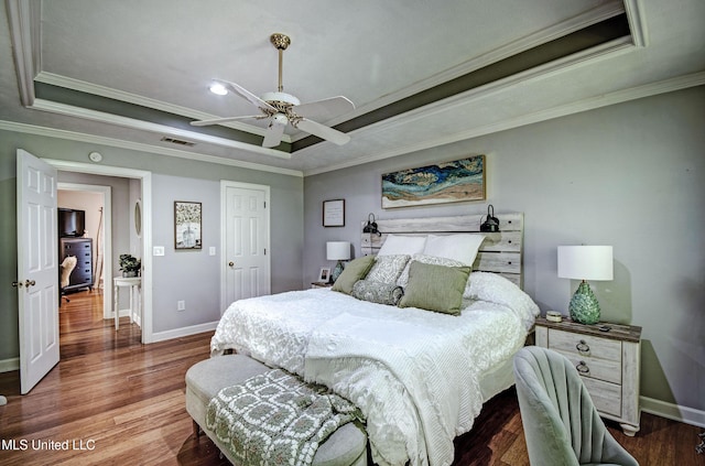 506 Ridge Cir, Brandon, MS 39047 - bedroom featuring a raised ceiling, wood finished floors, crown molding, and a ceiling fan