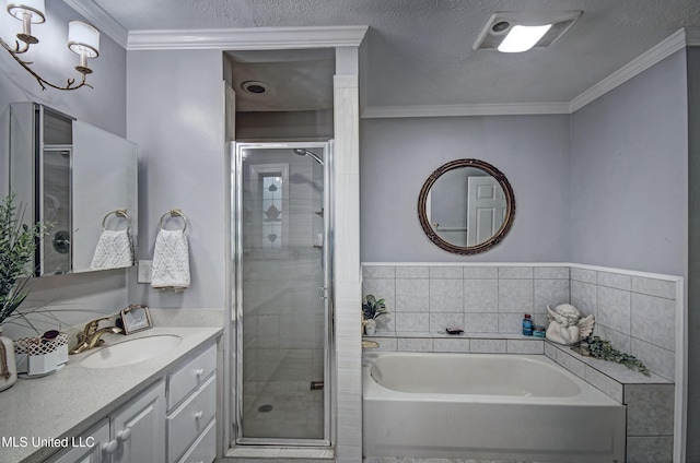 506 Ridge Cir, Brandon, MS 39047 - full bathroom featuring a shower stall, a bath, vanity, ornamental molding, and a textured ceiling