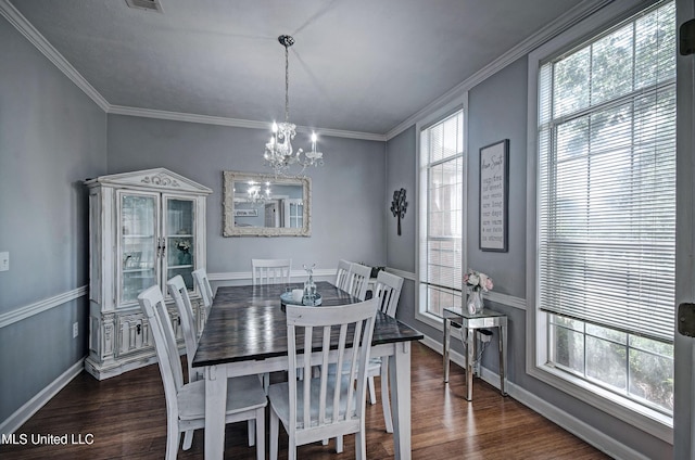 506 Ridge Cir, Brandon, MS 39047 - dining area featuring a chandelier, dark wood-type flooring, and crown molding