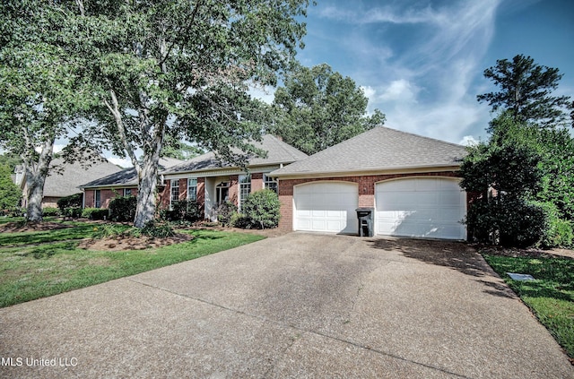 506 Ridge Cir, Brandon, MS 39047 - view of front of house with brick siding, driveway, an attached garage, a shingled roof, and a front lawn