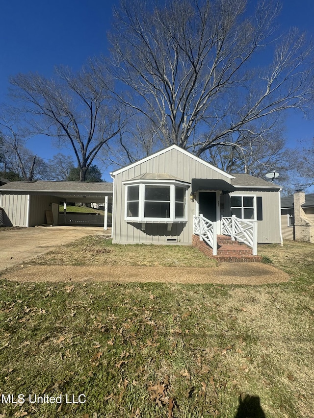 view of front of home featuring a front lawn and board and batten siding