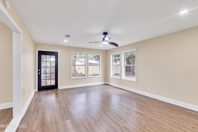 spare room with light hardwood / wood-style flooring and ceiling fan