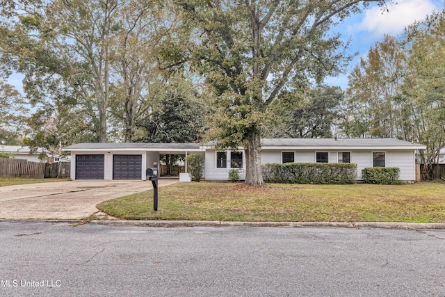 ranch-style home featuring a carport and a front yard