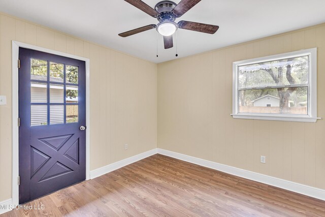 interior space with ceiling fan and light hardwood / wood-style flooring