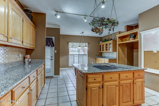 kitchen with light tile patterned floors, a textured ceiling, and tasteful backsplash