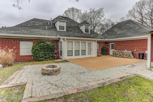 back of house with a patio area and an outdoor fire pit