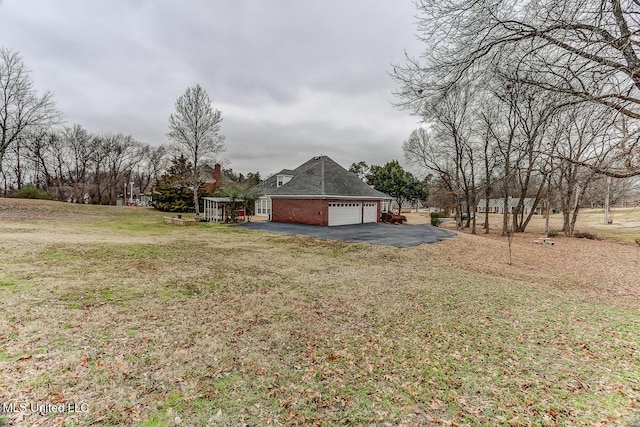 view of yard with a garage