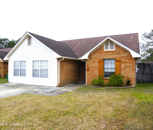 ranch-style house with a front lawn