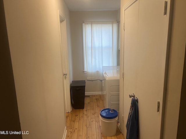 interior space featuring light hardwood / wood-style floors and washer / dryer