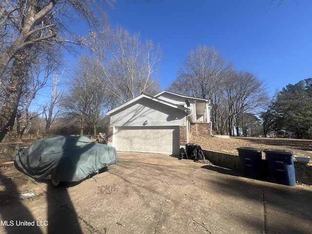 view of side of property featuring a garage