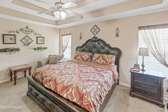 8436 Ansley Park Ln, Southaven, MS 38672 - carpeted bedroom with a tray ceiling and ceiling fan