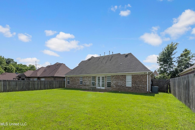8436 Ansley Park Ln, Southaven, MS 38672 - back of property featuring brick siding, french doors, a fenced backyard, and a shingled roof
