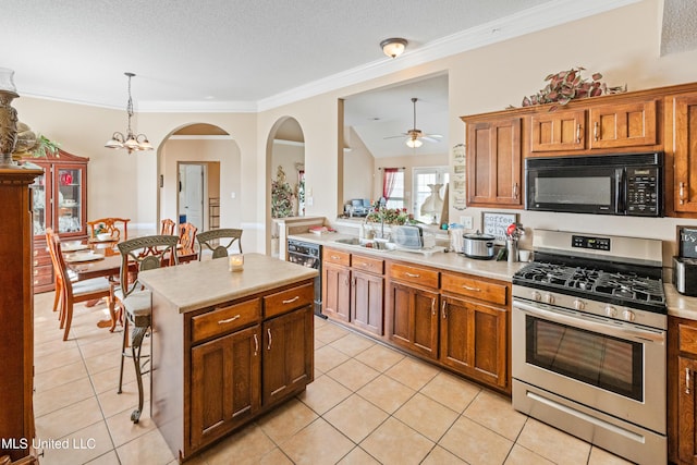 8436 Ansley Park Ln, Southaven, MS 38672 - kitchen featuring black appliances, light countertops, light tile patterned floors, crown molding, and a textured ceiling