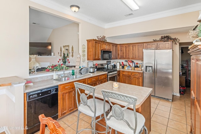 8436 Ansley Park Ln, Southaven, MS 38672 - kitchen with black appliances, light countertops, brown cabinets, light tile patterned flooring, and crown molding