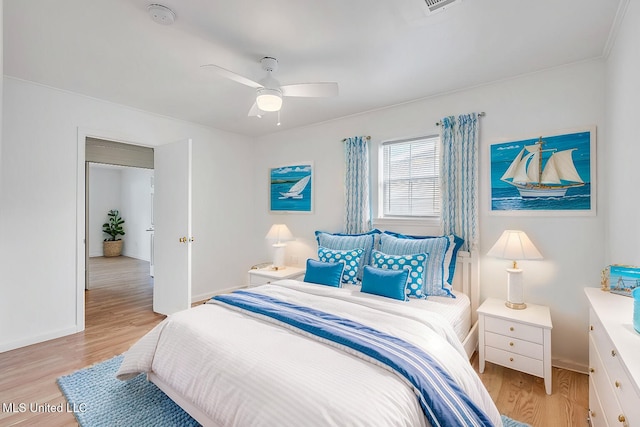 216 Buena Vista Dr, Long Beach, MS 39560 - bedroom featuring baseboards, a ceiling fan, and light wood finished floors